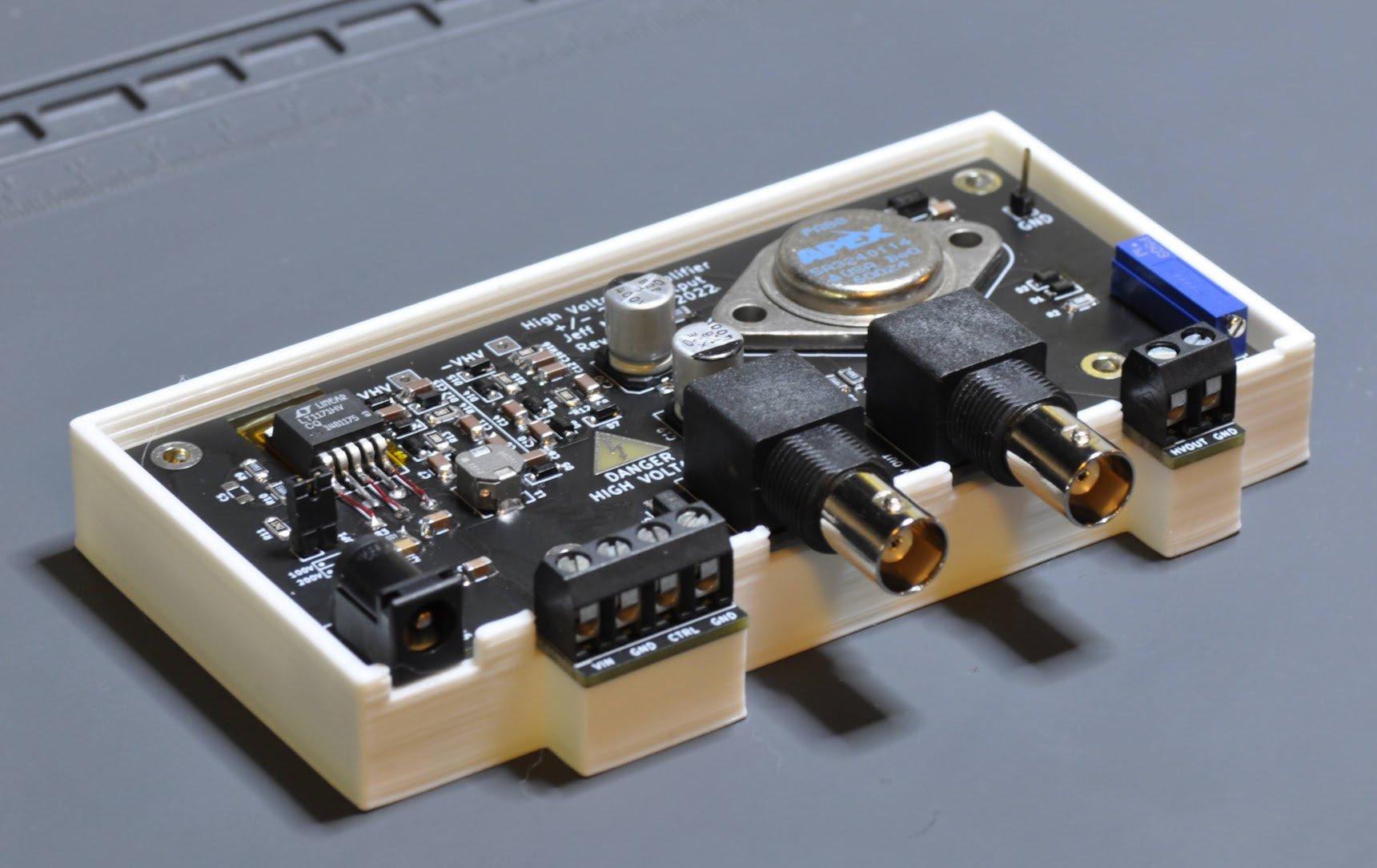 High voltage amplifier with top of case removed to show circuit board